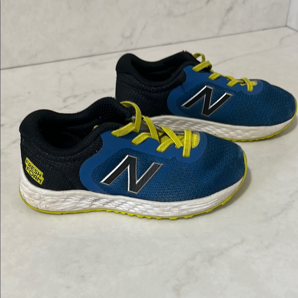 Good used condition New Balance Blue and Black Sneakers size toddler 9.5